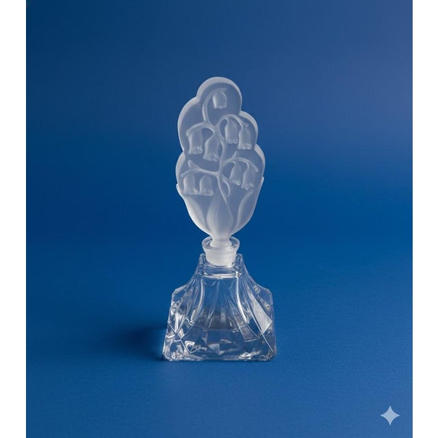 So very vintage! Look at the beautiful etched Lily of the Valley Intaglio stopper. The faceted bottle is labeled I. Rice...