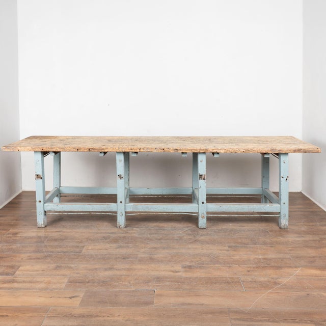 19th century Hungarian worktable, crafted in pine. The base retains its original light blue painted finish, now naturally...