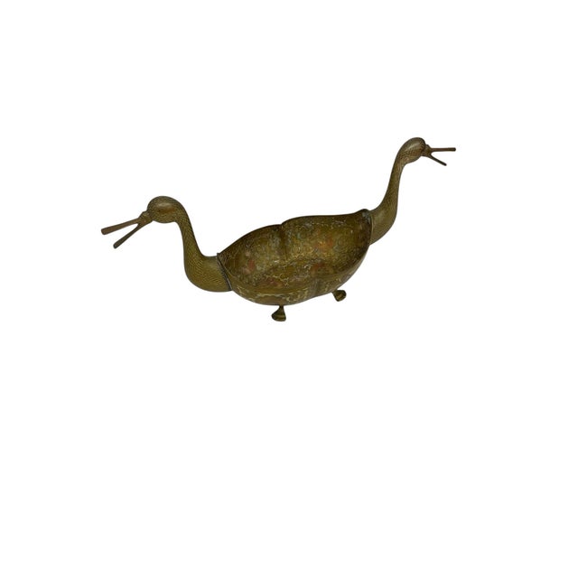 An exceptionally detailed mid-century brass toned decorative vessel featuring a rare double-duck form,with each end...
