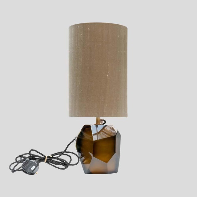 A beautiful pair of tobacco colour murano glass “rock” table lamps, brass structure by alberto dona. Sold without...