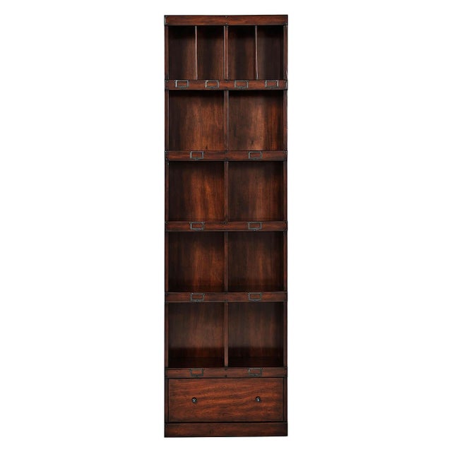 Bookcase stacks eight open shelf sections above a single long drawer, with four pigeonholes divided across the top bay and...