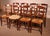 A delightful set of eight cherrywood straw-seated chairs. Beautiful French craftsmanship in cherrywood, which we have...
