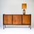 Three-door sideboard from the 1960s, designed by Roger Landault. Made of oak and raised on tapered square legs. The doors...
