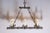 This 20th-century French wrought iron chandelier exemplifies rustic elegance with its sturdy construction and artisanal...