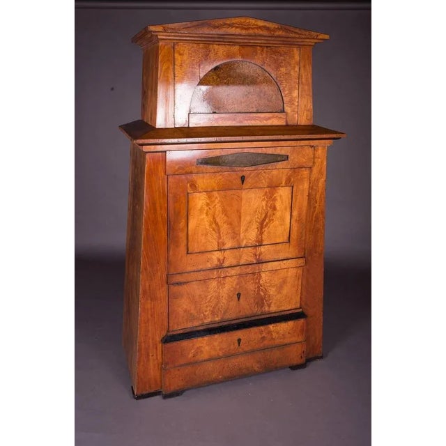 Solid, light mahogany and ash. Strong conical body with hatbox. Partially ebonised. (O-224). Wear consistent with age and...