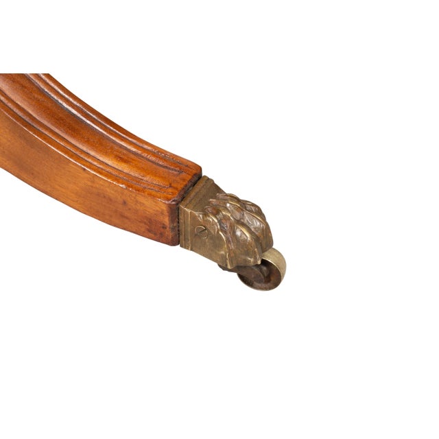 Likely Mid Atlantic states. With circular wood top with a conforming frieze with figured mahogany and with drawers with...