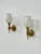 Pair of Maison Jansen wall sconces, each composed of a patinated solid brass structure in the shape of a hand holding an...
