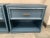 A vintage pair of faux bamboo nightstands painted in a soft grey blue. Original brassy, faux bamboo pulls on the drawers....
