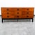 Handsome 9 drawer credenza dresser in walnut. Sculpted metal rounded handled within each drawer. Signed within the top...