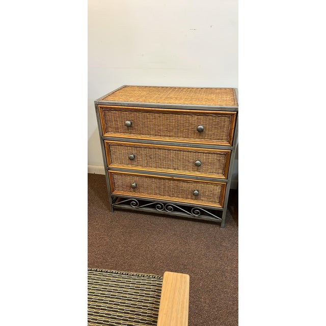 Metal framed, wicker, rattan dresser with nightstand Very solid drawers on her own rollers and open and close easily...