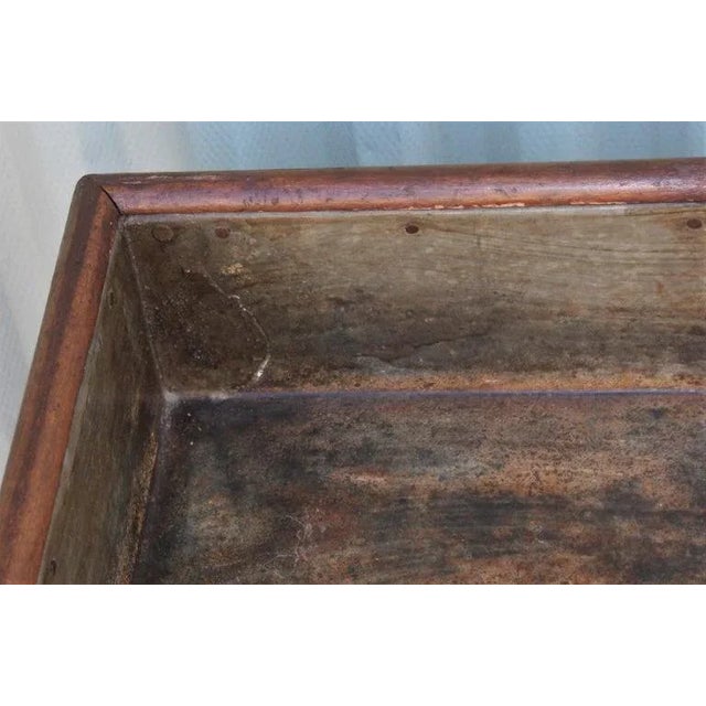This 19th century pine sorting table has an old surface and a tin liner that is original. At one time the legs would fold...