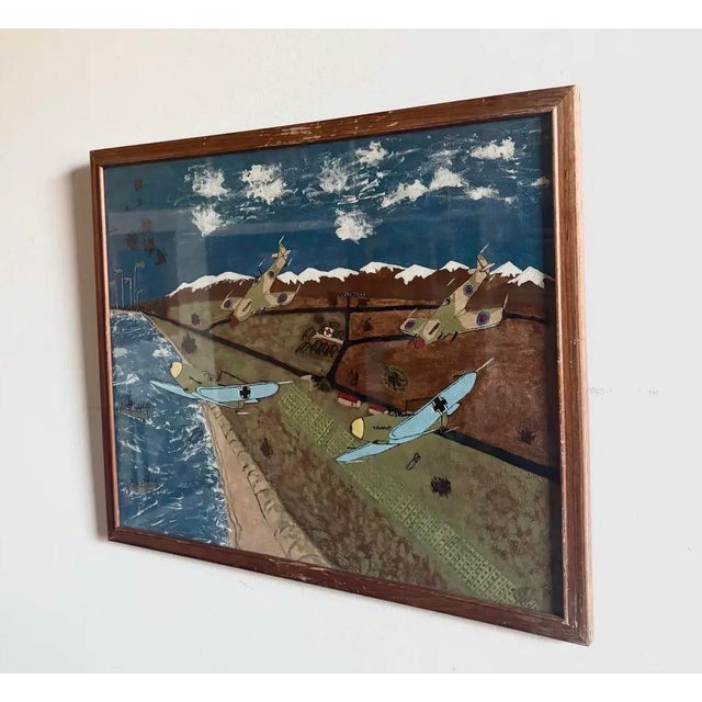 WWII narrative battle scene folk art painting, signed Gilbert W. Schuett. Artwork is 16"x20", in glass frame measuring...