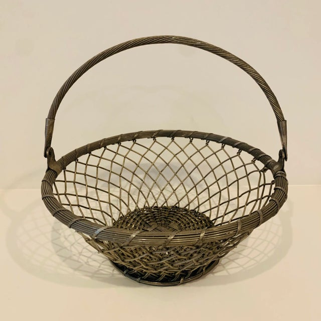 Vintage silver woven basket with handle Unmarked Measures roughly 12" high x 12.5" wide