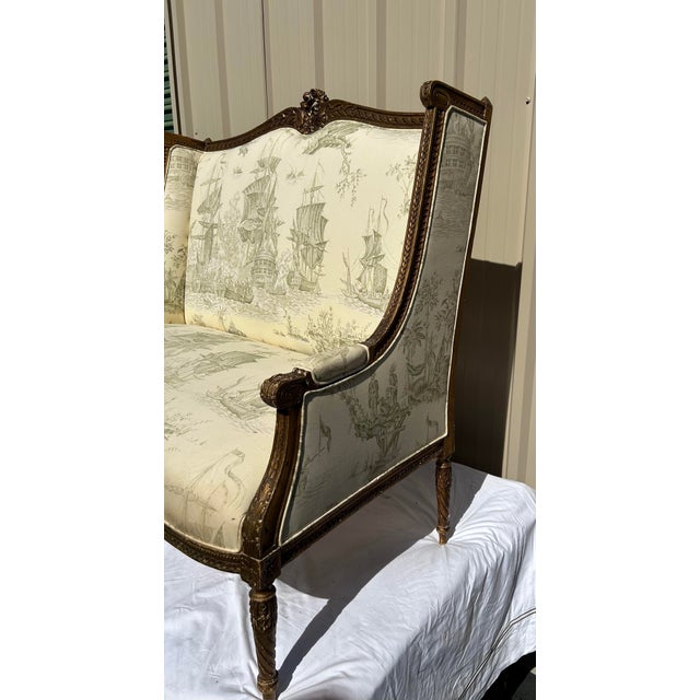 Wood Early 20th Century French Louis XVI Style Giltwood Settee in Naval Scenic Toile For Sale - Image 7 of 9