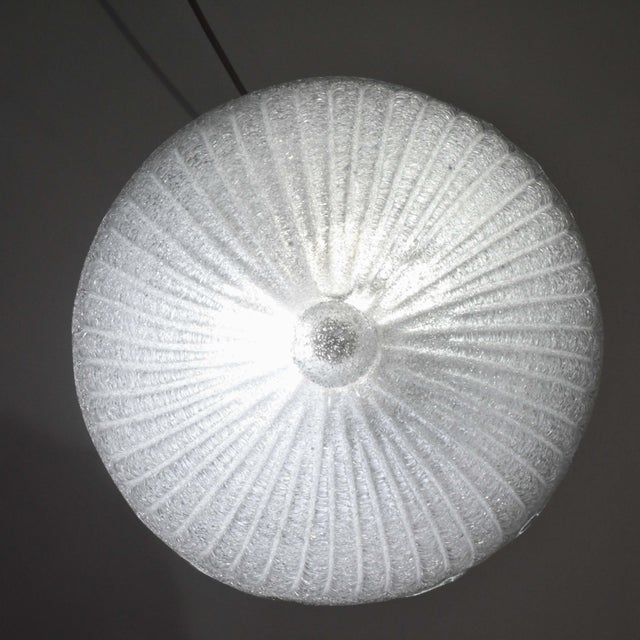 Stunning transparent/silver Murano ceiling light. The central plate is surrounded by a wavy transparent stripe typical of...
