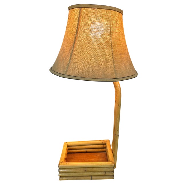 A wonderfully sculptural vintage bent bamboo table lamp that effortlessly blends tropical, coastal, and Hollywood Regency...