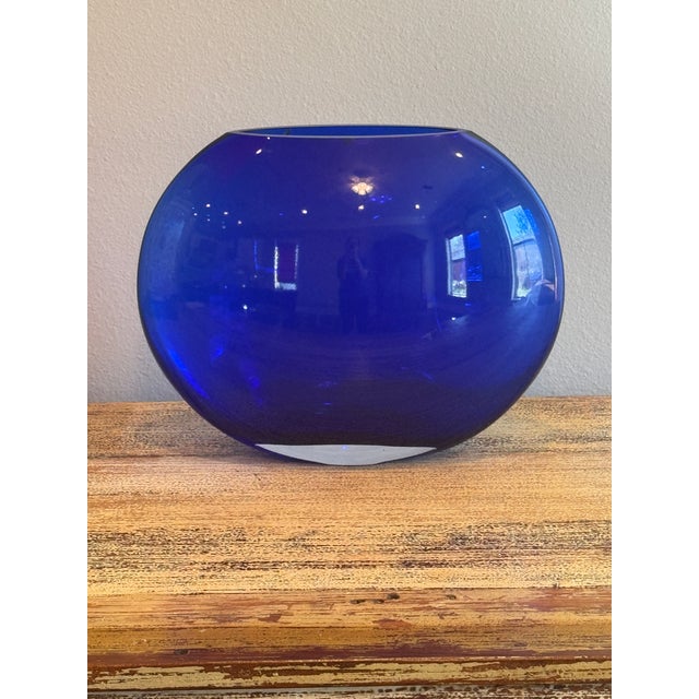 Make a bold statement with this striking vintage art glass vase featuring a rich, luminous cobalt blue hue. Crafted with...