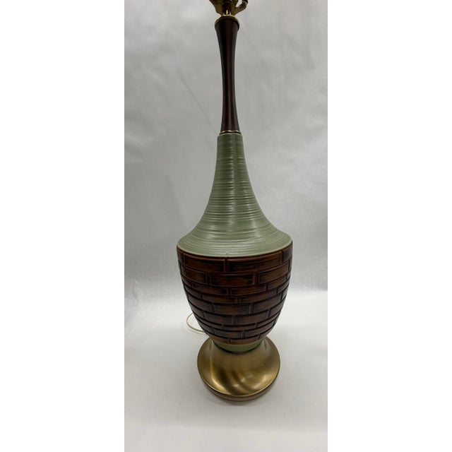 Bring authentic Mid-Century Modern character to your space with this vintage all-ceramic table lamp. Featuring a striking...