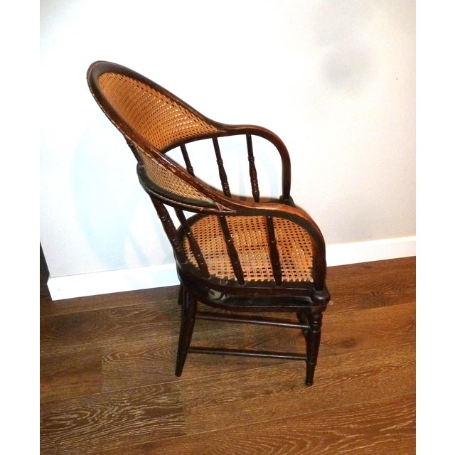 Extremely rare Antique Firehouse Cane Barrel Tilting Armchair. There are two tilting springs under seat that allow up to a...