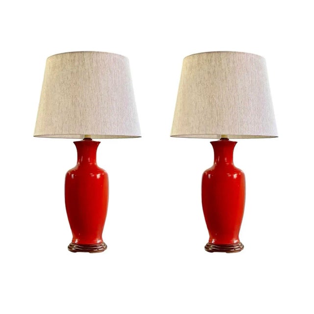 Bold color and classic form make these vintage table lamps true statement pieces. In vibrant burnt orange, each rests upon...