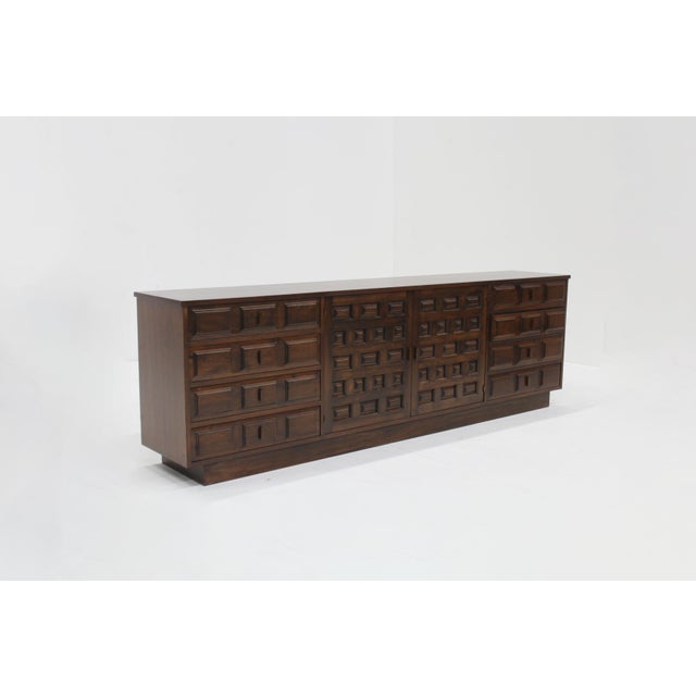 Spanish Brutalist Sideboard in stained Mahogany wood with panelled geometric front. Beautiful piece from the 1970s. Plenty...