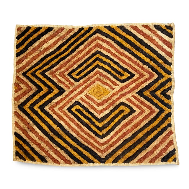 Traditional vintage Kuba grass textile handmade from the indigenous people of the Congo. Bold geometric patterns created...