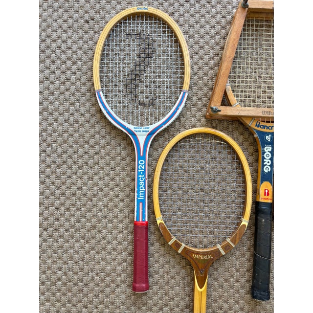 Five midcentury vintage tennis rackets, with two covers (not photographed) and one wooden press. Great wall decor for game...