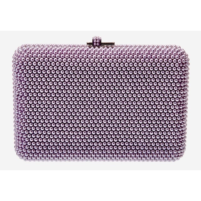 Effortlessly blend timeless sophistication with contemporary chicness with this timeless Slim Slide crystal evening bag in...