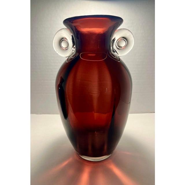 Add a striking touch of modern art glass to your collection with this beautiful pair of hand-blown glass vases. Featuring...