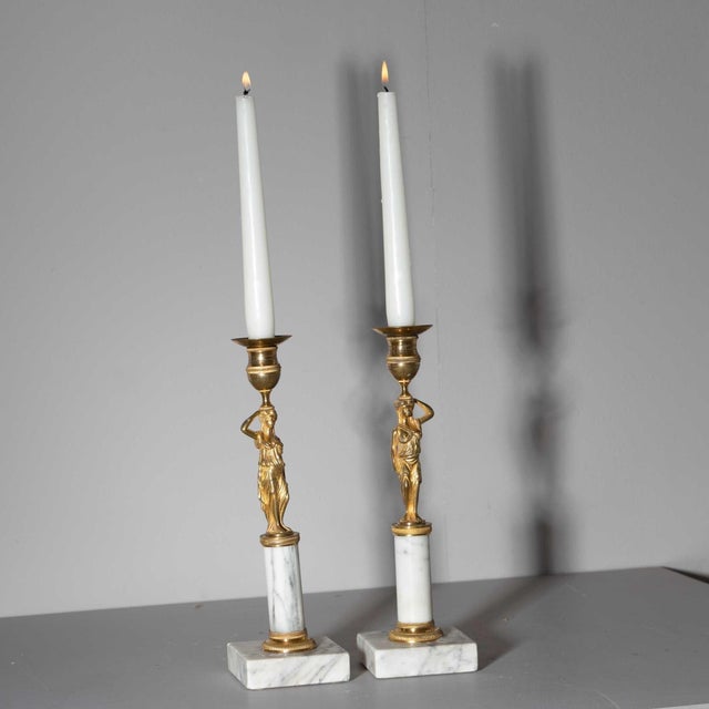 Pair of Empire candlesticks with bronze karyatids and white marble pedestals, crafted by Werner & Mieth in Berlin during...