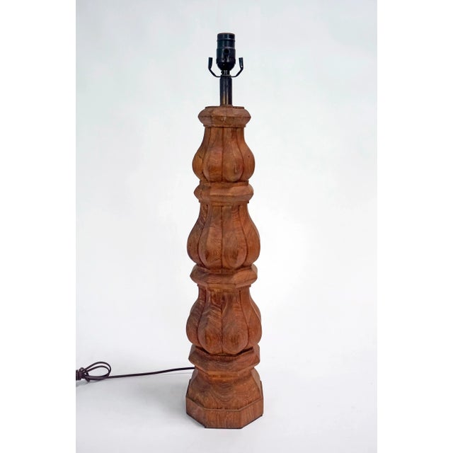 A large, balustrade, hand-carved, redwood table lamp; dark-tinted, brass neck. Dimmer switch on brown cord. Recently...