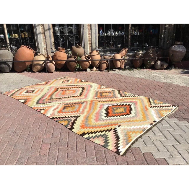 This beautiful, vintage, handwoven kilim is approximately 60 years old. It is handmade of wool and cotton in all natural...