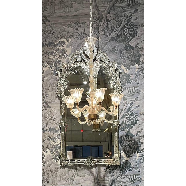 A classic Italian Venetian mirror in the Baroque style. Beautiful intricate beveled detail around the mirror plate with...