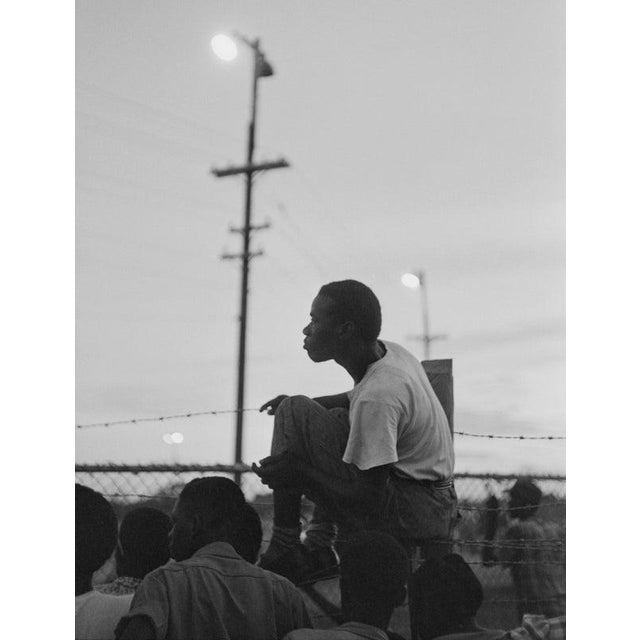 Jamaican Spectators 12th December 1953: Spectators at a cycling race track on the outskirts of Kingston, Jamaica. Original...