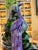 This striking ceramic sculpture depicts a standing peacock, a traditional symbol of beauty, dignity, and good fortune. The...