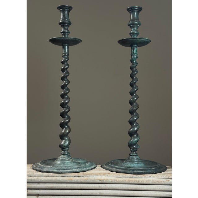 Pair of Large Vintage Verdigris Bronze Barley Twist Candelabras Dimensions: 18.75”H x 7.4”D A pair of large bronze...
