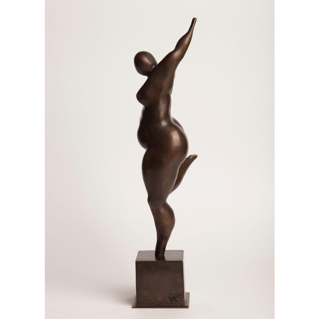 "Fall" — from the Seasons series A contemporary figurative bronze of a dancing woman, one arm flung high and one leg...