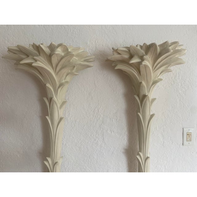 Pair of Serge Roche-Style Palm Torchères. Elegant white-painted torchière floor lamps featuring dramatic palm frond...