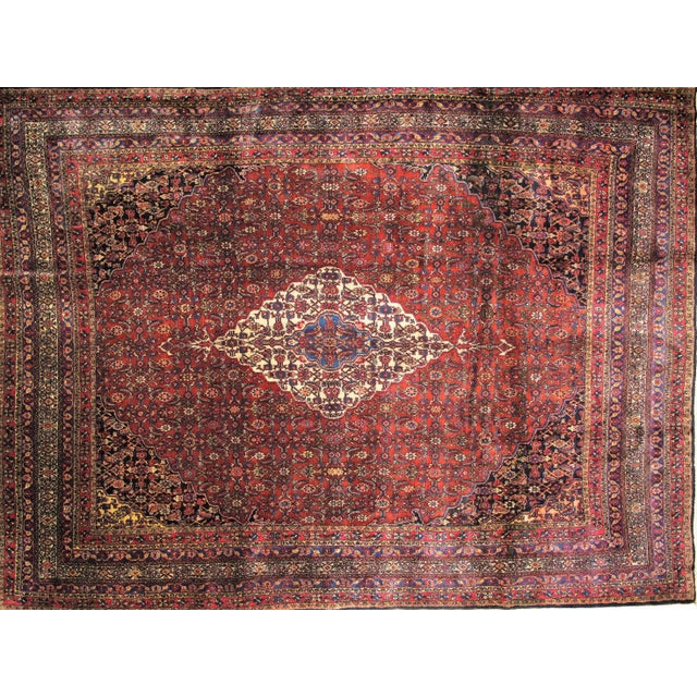 Offering this wool pile handwoven antique Persian Bibikabad carpet in excellent condition. The piece dates back to the...