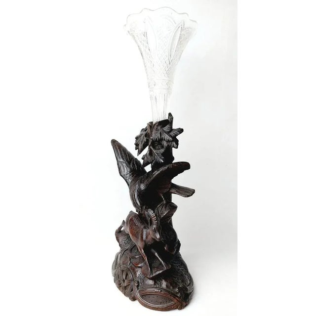This early 19th century black forest walnut is handcarved and present a Eagle atacking a Herz. Carved walnut and glass...