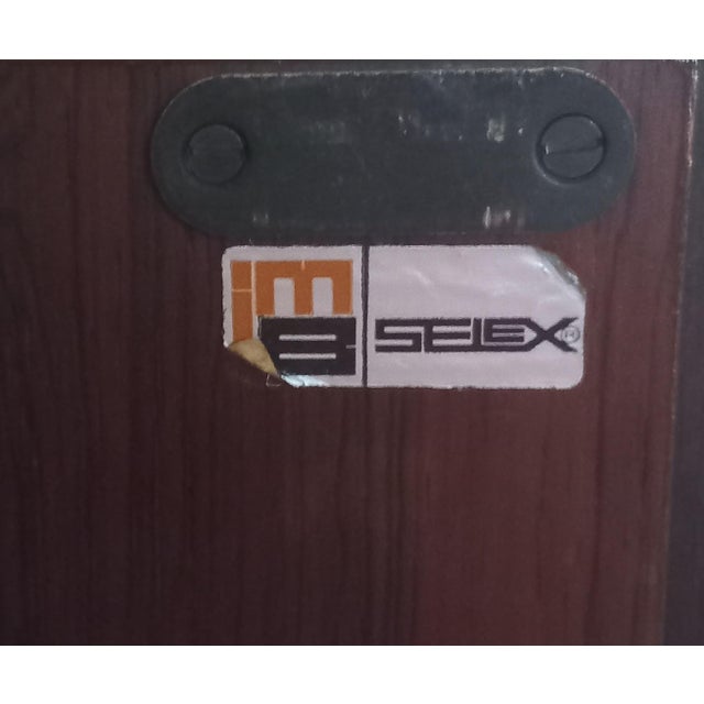 This stunning wall bookcase was made in Italy in the 1960s by the renowned Italian furniture firm Industria Mobili...