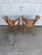 Pair of barrel back woven rattan chairs. The backs slope down into the arms creating a barrel back. The arms are woven...