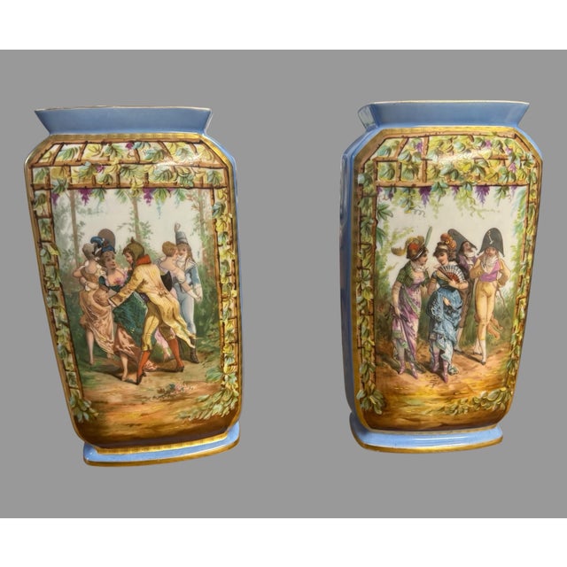 Beautiful pair of antique hand-painted porcelain vases, likely 19th-century Continental / Old Paris type, each featuring...
