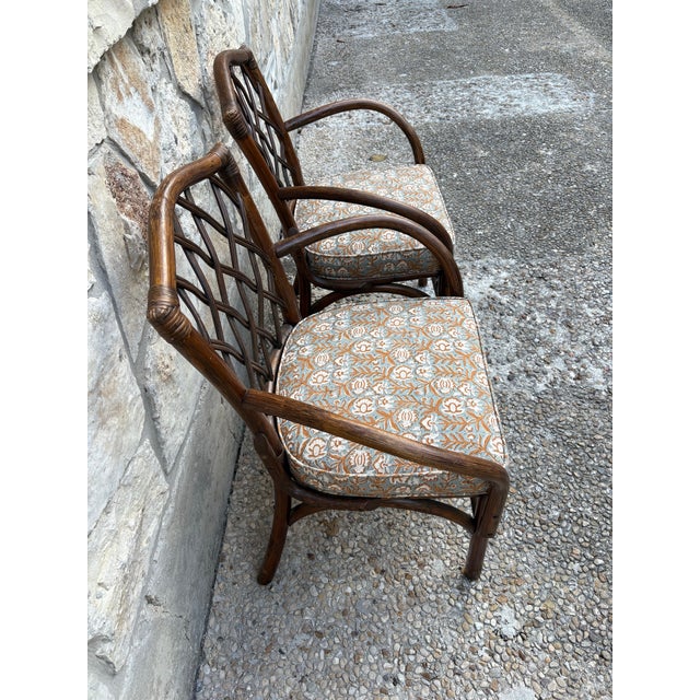 Unique Pair of Vintage Diamond Lattice Bent Arm Chairs. A striking pair of vintage armchairs featuring an intricate faux-...
