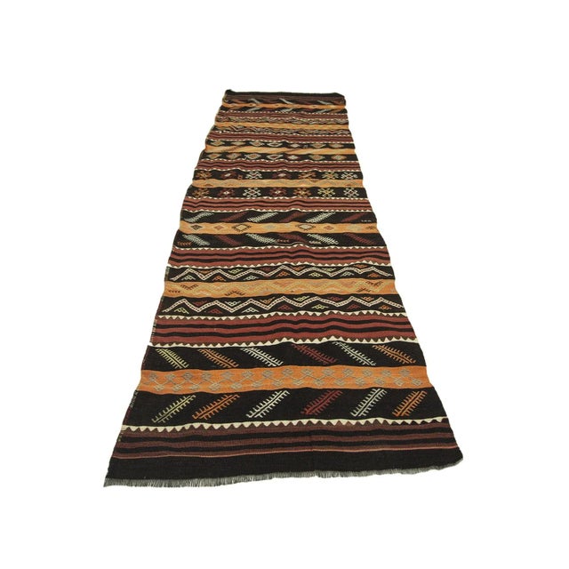 Handwoven vintage kilim runner rug from Malatya region of Turkey. Approximately 50-60 years old. In very good condition.