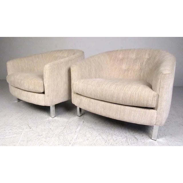 Pair of modern low profile lounge chairs with rounded tufted backs and square tube aluminum legs. with dealer. Dimensions:...