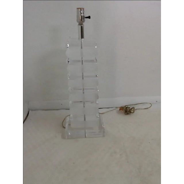 1970s Karl Springer style table lamp with two tones, matte and high polish lucite. In great condition. The measurements of...