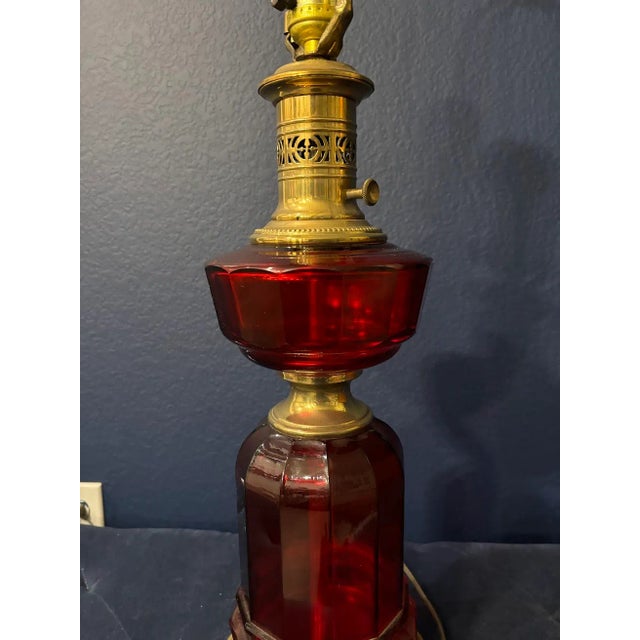 This RARE & sensational Red Glass & Brass lamp by Paul Hansen is simply beautiful!!! Reminiscence of a oil lamp, but with...