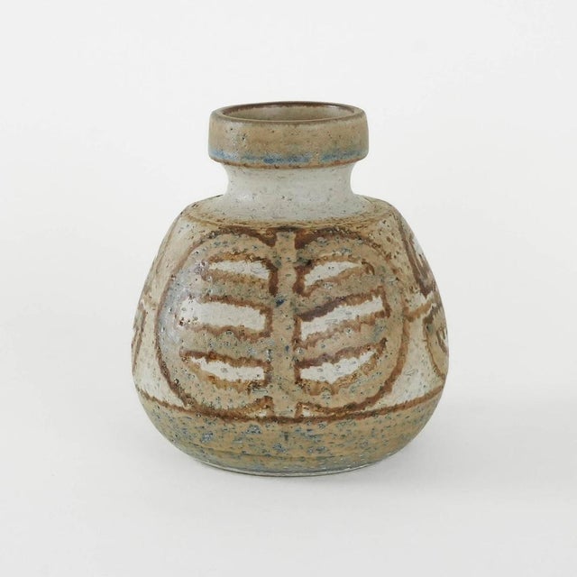 The vase was made in the 1960s by the renowned Danish manufacturer Søholm. Its organic form is decorated with a...