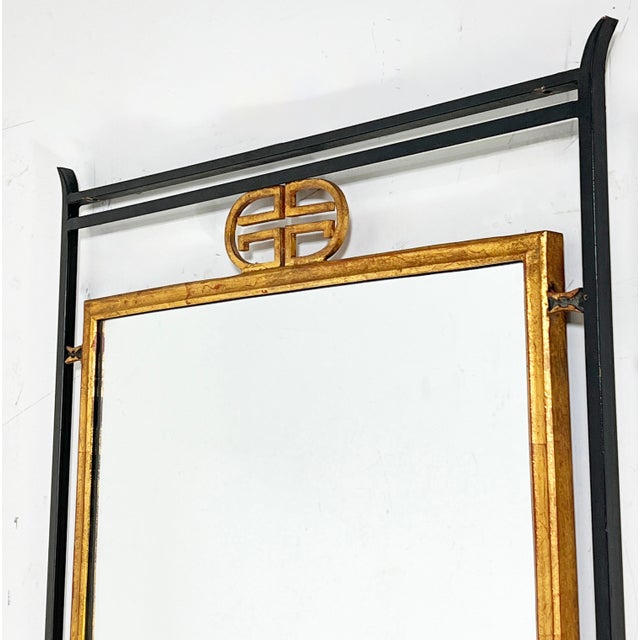 A neoclassically styled Italian gilded and wrought iron wall mirror and marble top console by the distinguished maker...